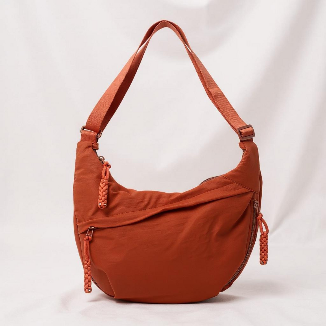 Gayle half-moon sling bag in orange
