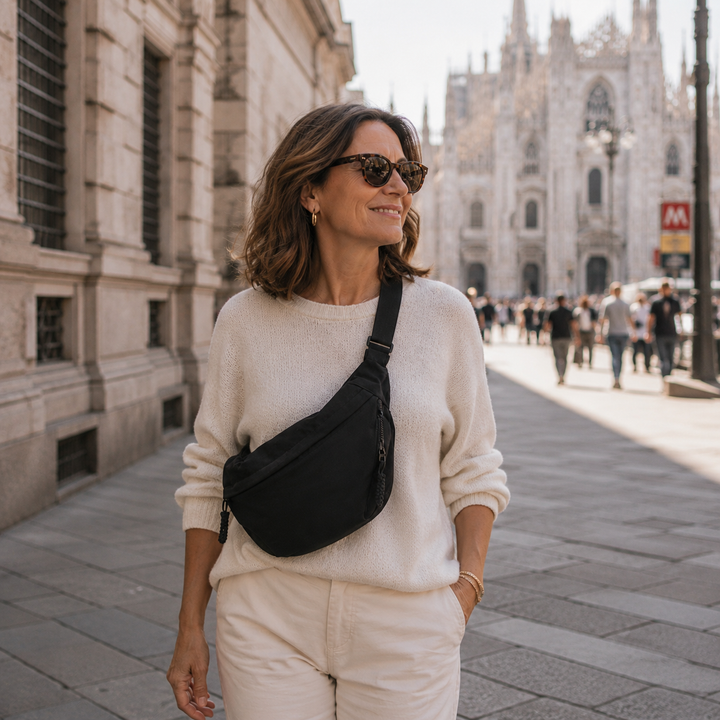 Woman wearing the Gayle half-moon sling bag across the body